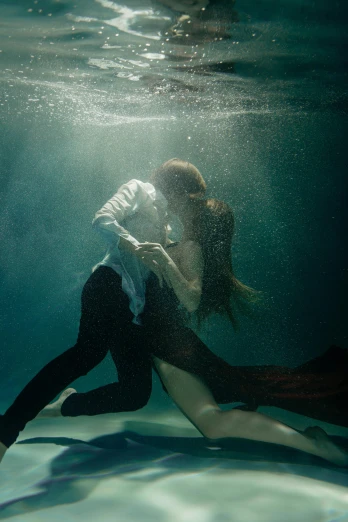 a man and a woman kissing under water, an album cover, unsplash contest winner, renaissance, movie still of emma watson, ignant, annie liebovitz photography, taken in 2022