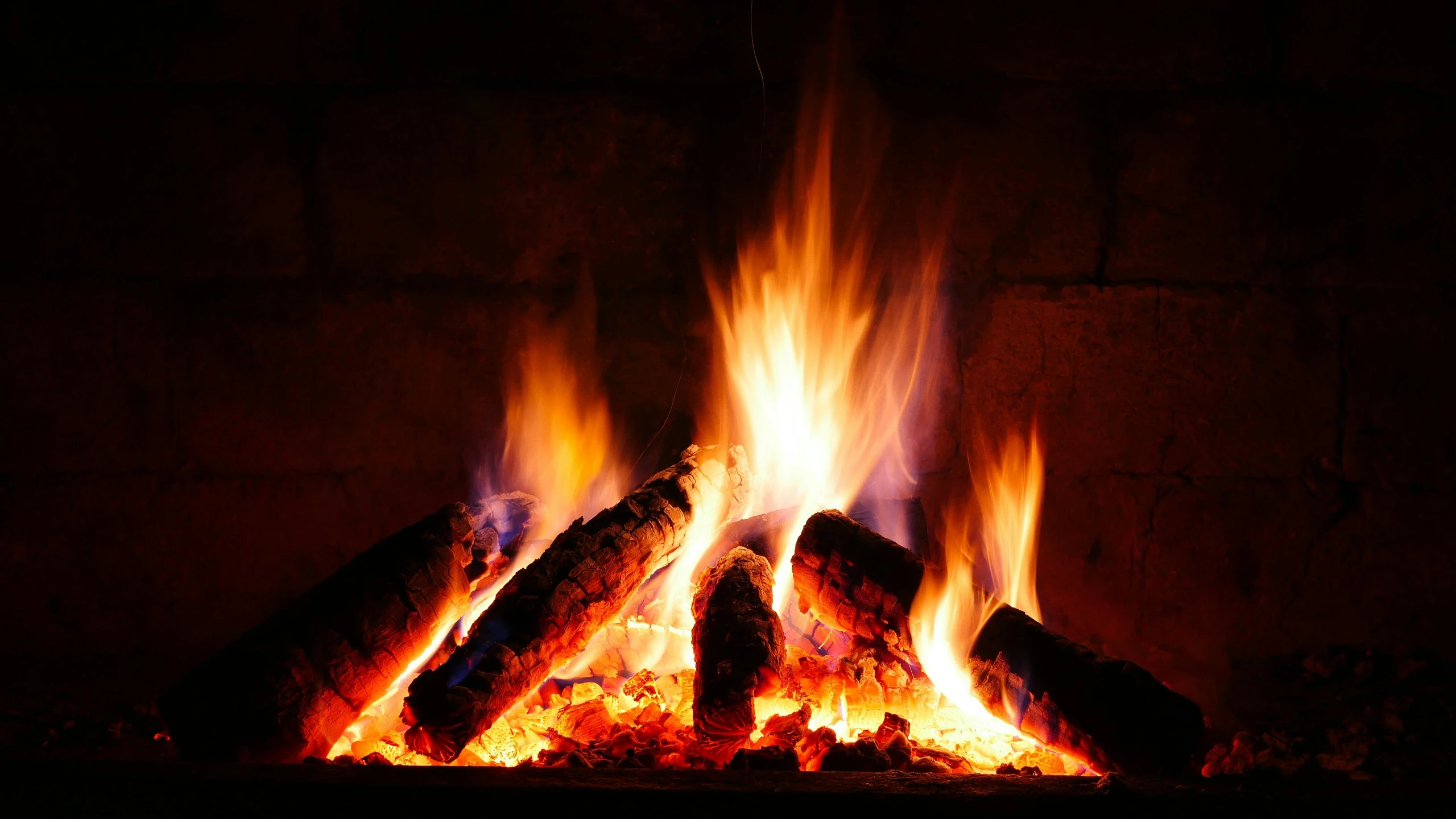 a close up of a fire in a fireplace, by Niko Henrichon, shutterstock, multiple stories, profile pic, multicoloured, winter setting