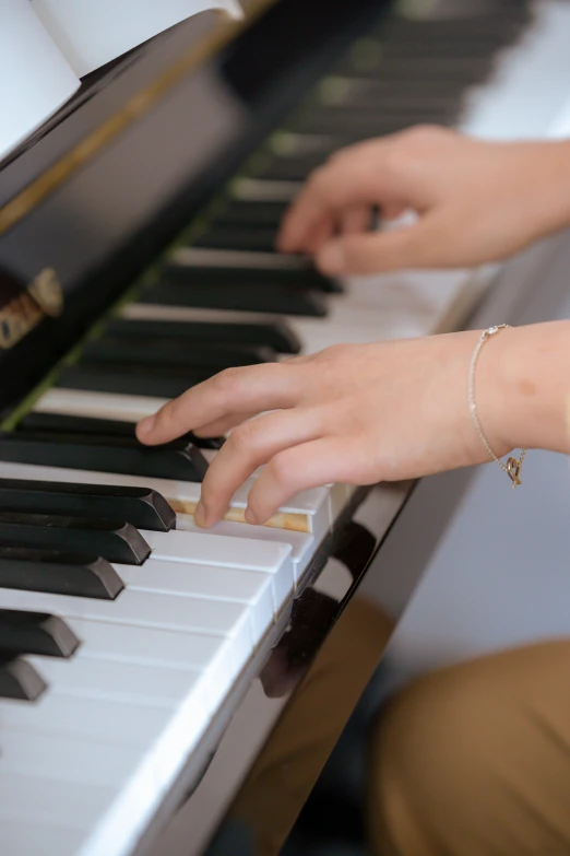 a close up of a person playing a piano