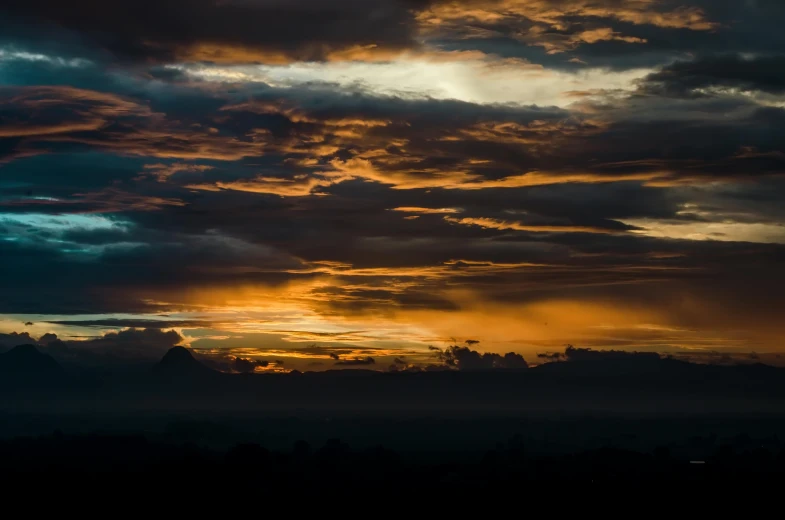 the sun is setting behind the clouds in the sky, by Peter Churcher, pexels contest winner, sumatraism, on a dark background, panorama, ((sunset)), atmospheric artwork