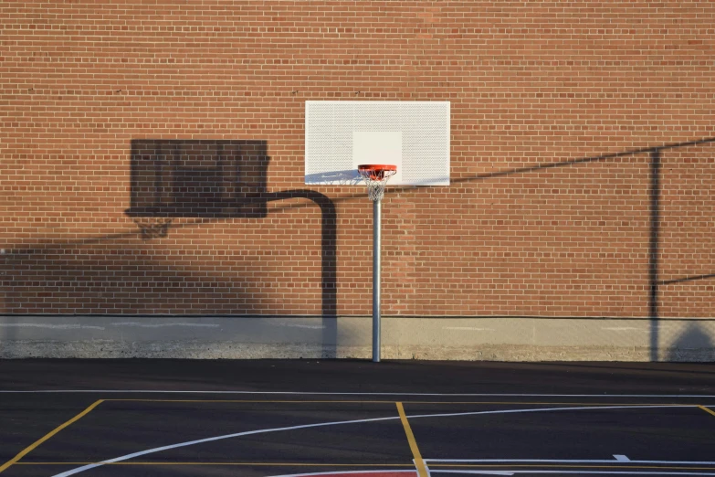 a basketball court in front of a brick building, by Andrew Domachowski, vancouver school, alessio albi, square lines, 15081959 21121991 01012000 4k, minimal composition
