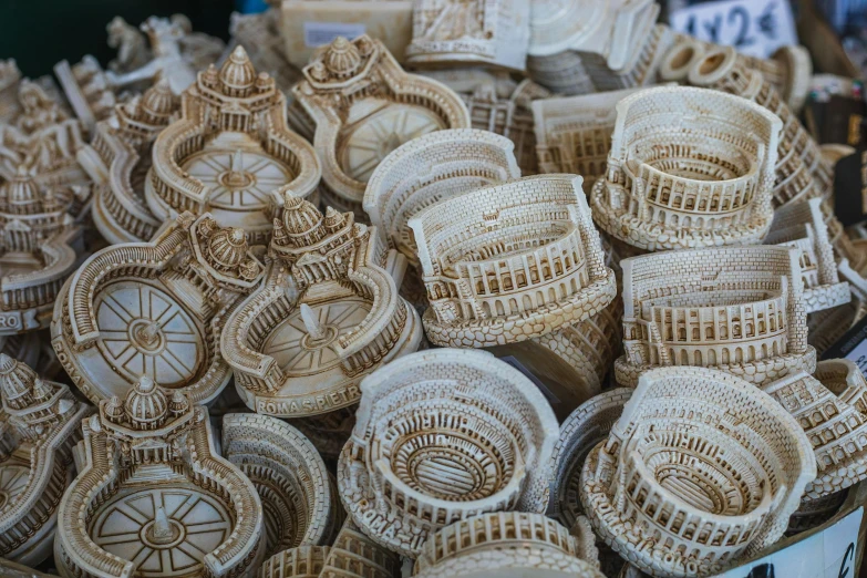 a bunch of baskets sitting on top of a table, a marble sculpture, intricately detailed buildings, fractal ivory carved ruff, zoomed in, market in ancient rome