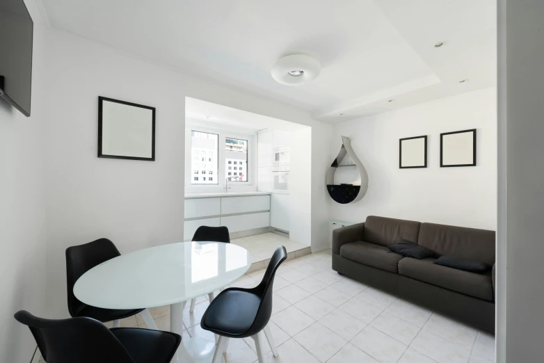 a living room filled with furniture and a flat screen tv, a photo, by Gavin Hamilton, unsplash contest winner, light and space, white tile on the floor, doctors office, white kitchen table, white and black color palette