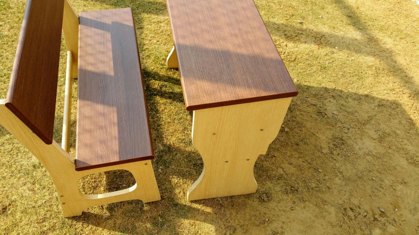 a couple of wooden benches sitting on top of a grass covered field, dau-al-set, [ overhead view of a table ]!!, full daylight, less detailing, two - tone