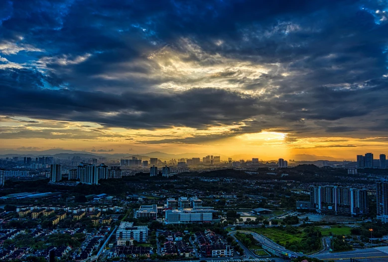 an aerial view of a city at sunset, by Joseph Severn, pexels contest winner, sumatraism, dramatic sky, panoramic, malaysian, 1 5 0 4