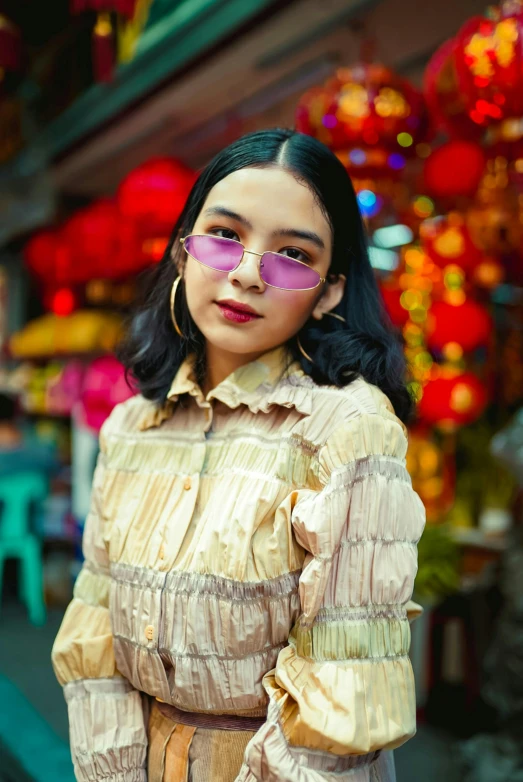 a woman standing in front of a store, an album cover, inspired by Ruth Jên, trending on pexels, square glasses, young asian girl, purple, malaysian