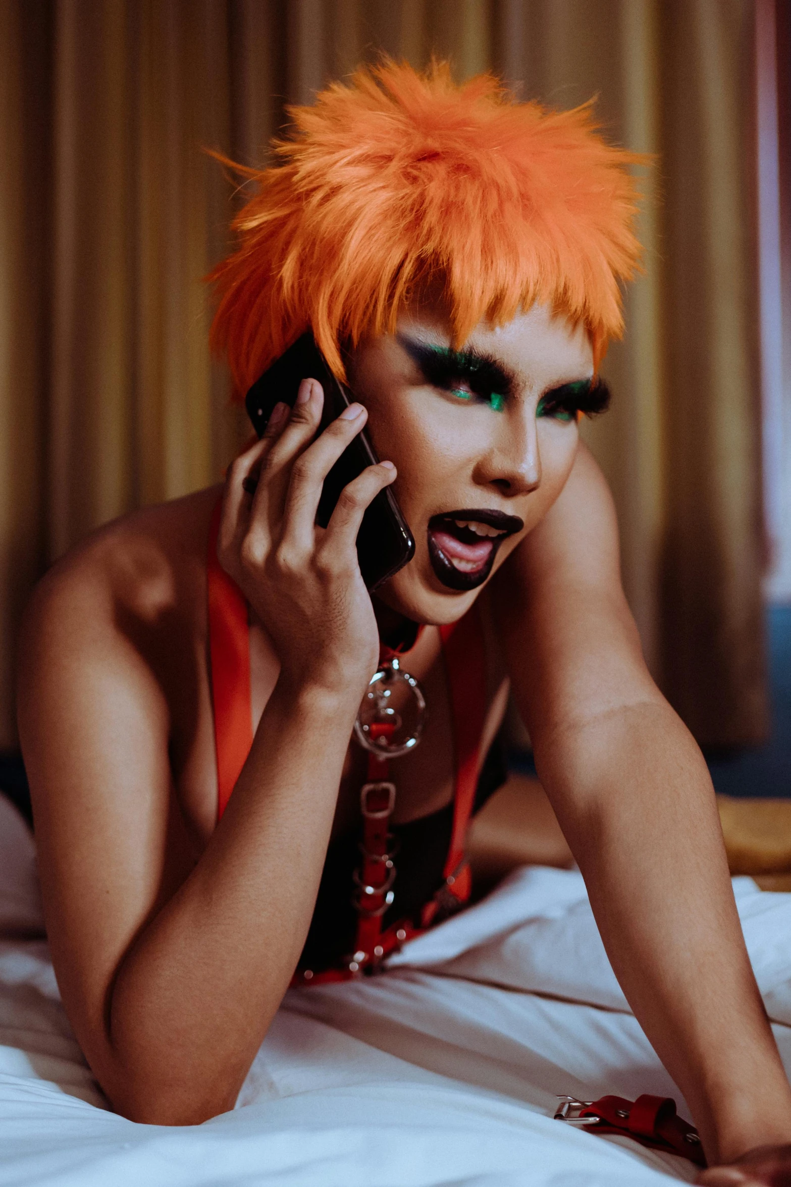 a woman with orange hair talking on a cell phone, an album cover, trending on pexels, androgynous vampire, drag, hotel room, 2 0 0 0's photo