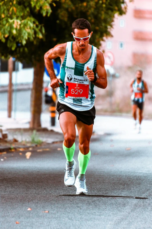 a man that is running in a race, pexels contest winner, renaissance, wearing a tank top and shorts, 🚿🗝📝, jesus alonso iglesias, green legs