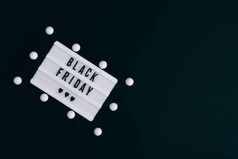 a black friday sign surrounded by white pills, trending on unsplash, hurufiyya, gif, decorations, black mirror series, background image