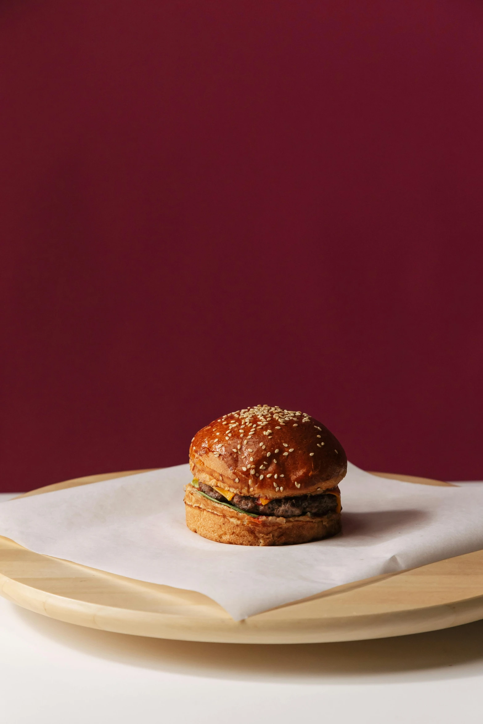 a sandwich sitting on top of a plate on a table, voluptuous sesame seed bun, demna gvasalia, square, f / 1