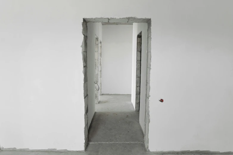 an empty room with a hole in the wall, inspired by Thomas Struth, pexels contest winner, conceptual art, white pale concrete city, doorway, under construction, rectangle