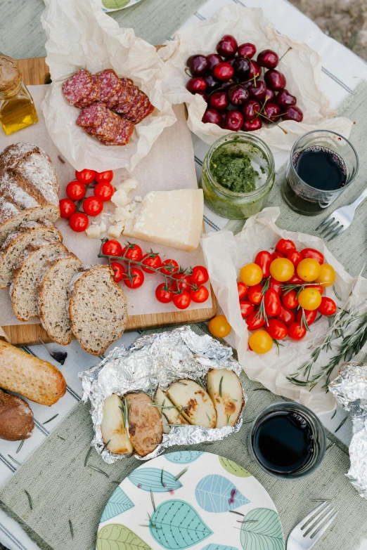 a table that has a bunch of food on it, unsplash, picnic, glossy surface, epicurious, 6 pack