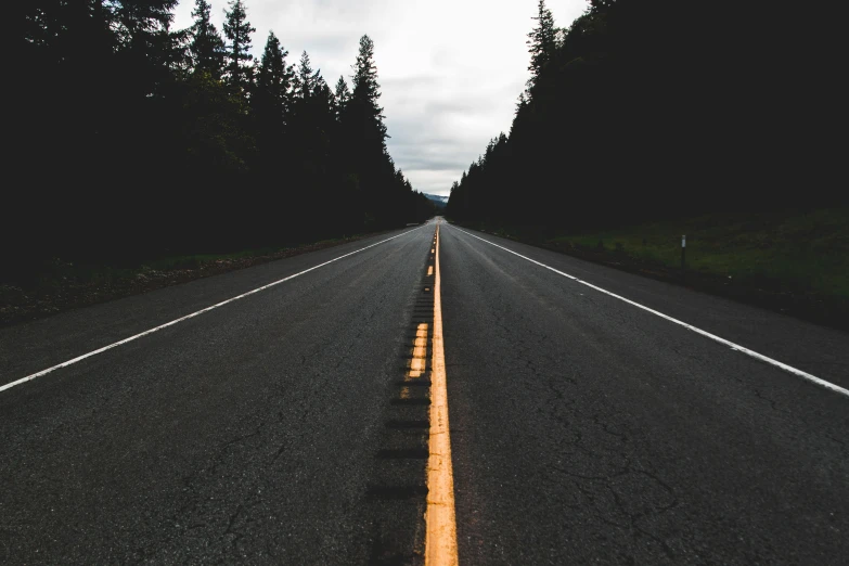 an empty road in the middle of a forest, an album cover, unsplash contest winner, postminimalism, asphalt and metal, background image, washington state, 🚿🗝📝