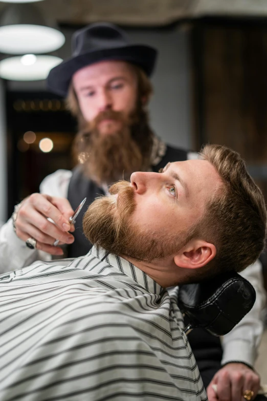 a man cutting another man's hair in a barber shop, trending on pexels, renaissance, bushy moustache, square masculine jaw, ilustration, australian