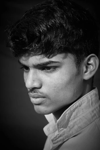 a black and white photo of a young man, by Max Dauthendey, monochrome:-2, boyish face, unibrow, nivanh chanthara