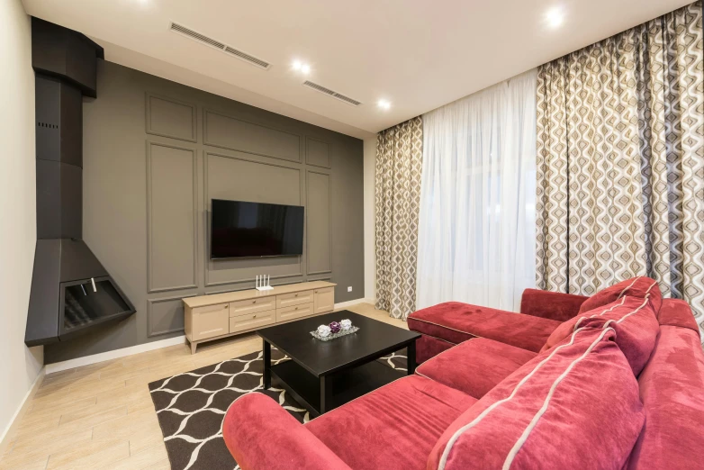 a living room filled with furniture and a flat screen tv, by Adam Marczyński, pexels contest winner, maroon accents, square, beige, construction