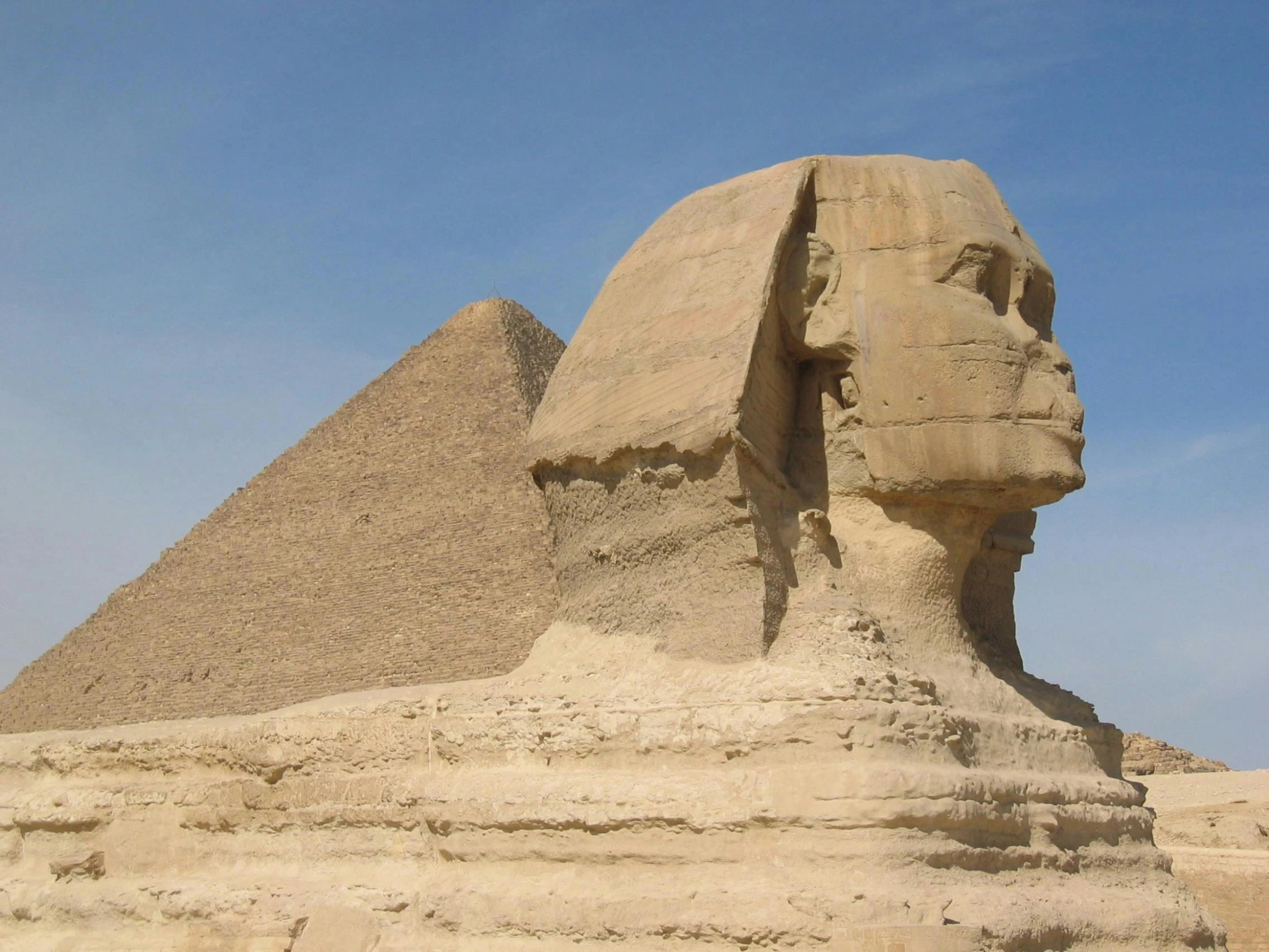 a large sphinx statue in front of a pyramid, pexels contest winner, national geograph, sweltering, dessert, islamic