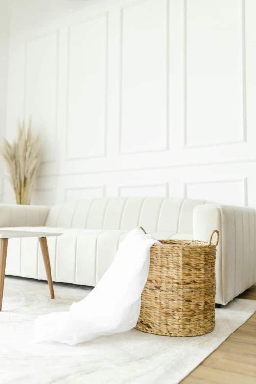 a living room filled with furniture and a white couch, pexels contest winner, minimalism, natural textures, promo image, white table, beige