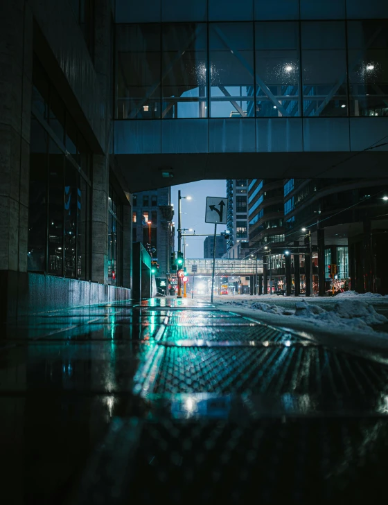 a city street filled with lots of traffic at night, a picture, by Ryan Pancoast, unsplash contest winner, wet reflective tile floor, toronto city, glass and steel, cinematic morning light