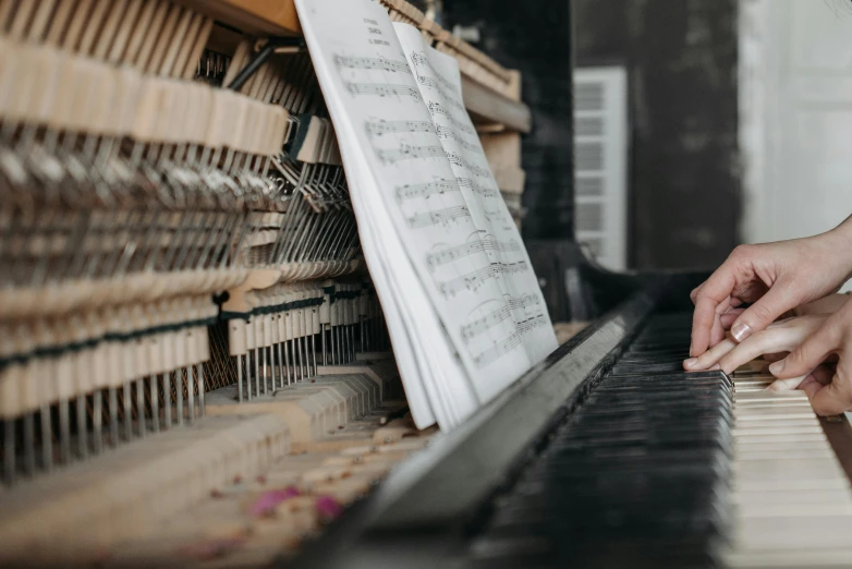 a close up of a person playing a piano, an album cover, pexels contest winner, 15081959 21121991 01012000 4k, lachlan bailey, an abandoned, highly mechanical