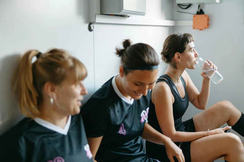 a group of women sitting next to each other drinking water, a photo, dribble, dingy gym, profile image, sanja stikovic, postapo game