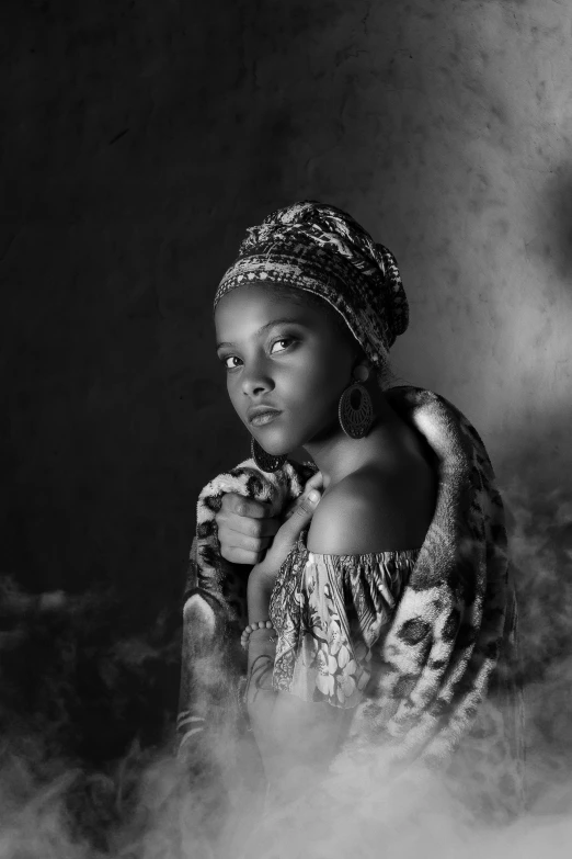 a woman in a black and white photo, inspired by Carrie Mae Weems, ancient libu young girl, african princess, tessa thompson inspired, wrapped arms