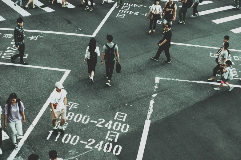 a group of people walking across a street, pexels contest winner, street art, kanji markings, square, cool marketing photo, scientific photo