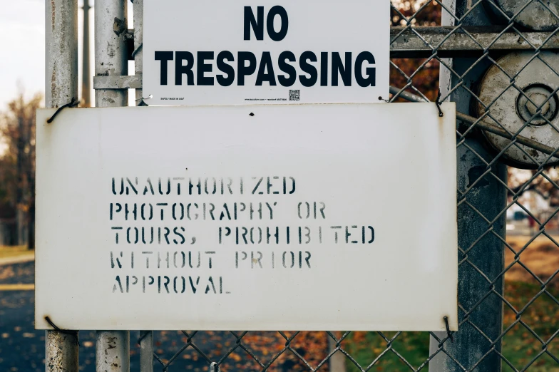 a no trespassing sign on a chain link fence, a poster, inspired by Elsa Bleda, unsplash, graffiti, thumbnail, vintage photo, touring, 🎨🖌️