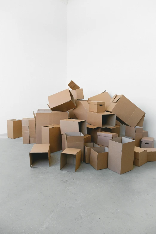 a pile of cardboard boxes in an empty room, reddit, conceptual art, ignant, yael shelbia, plain background, leaked image