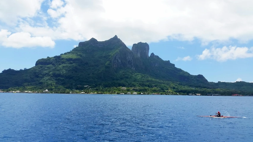 a large body of water with a mountain in the background, a picture, polynesian style, listing image, craggy, view from the sea