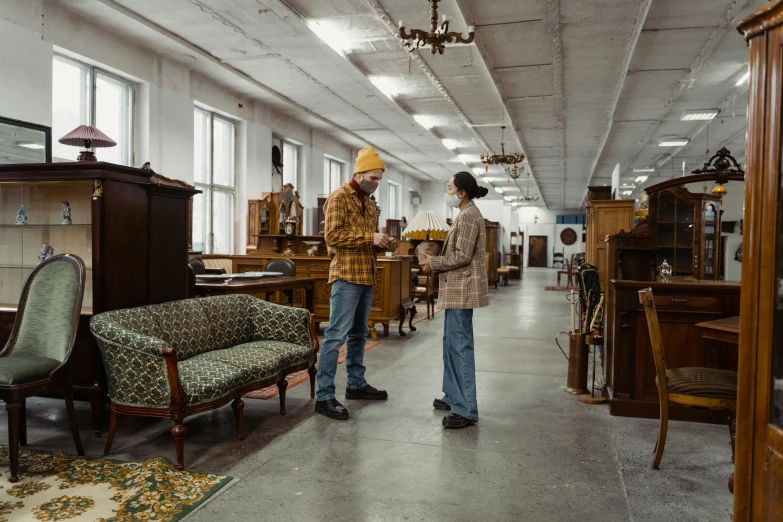 a couple of men standing next to each other in a room, by Everett Warner, pexels contest winner, arte povera, lots of furniture, inspect in inventory image, jugendstil, azamat khairov