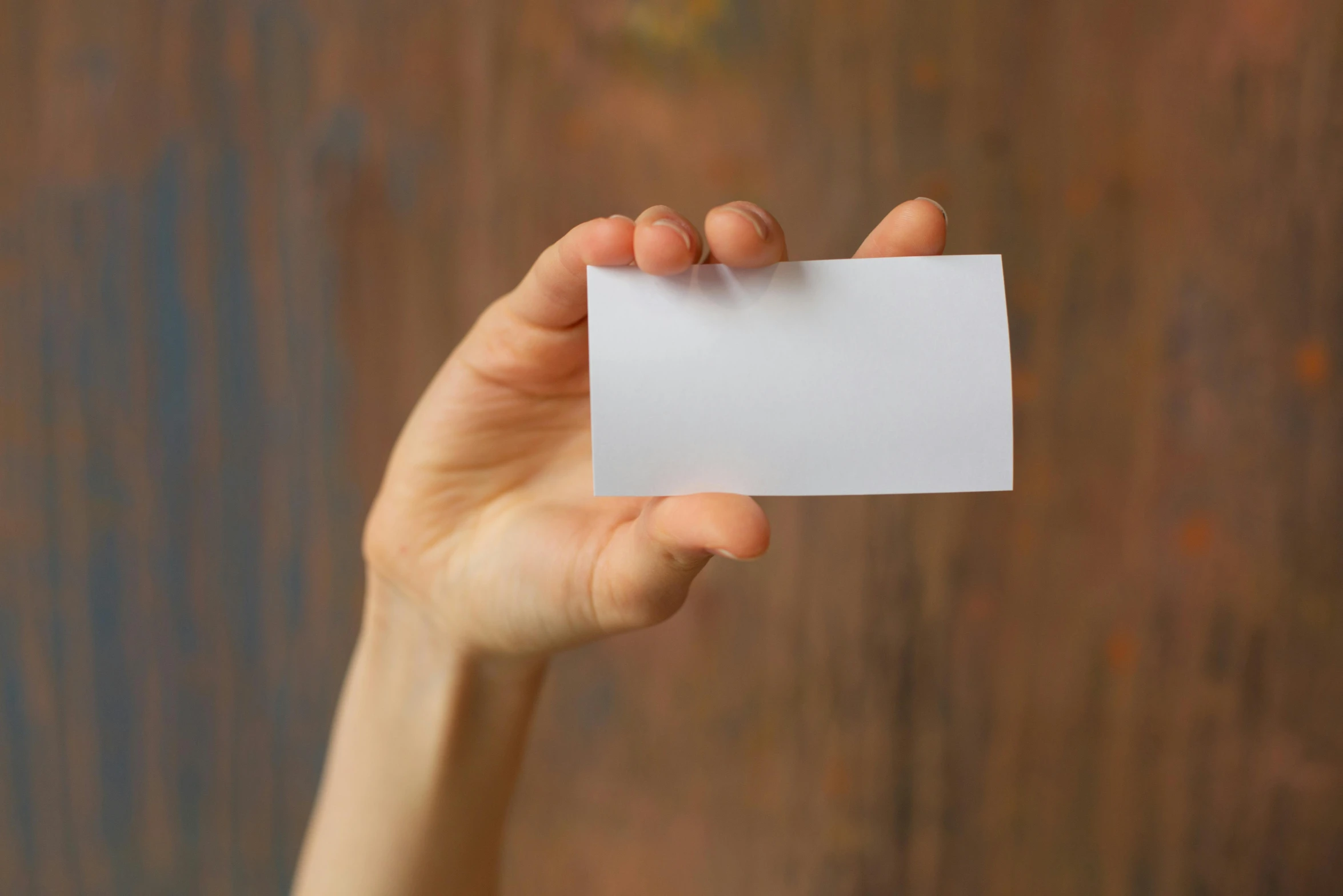 a person holding a piece of paper in their hand, pexels, private press, square, porcelain organic tissue, business card, very tiny