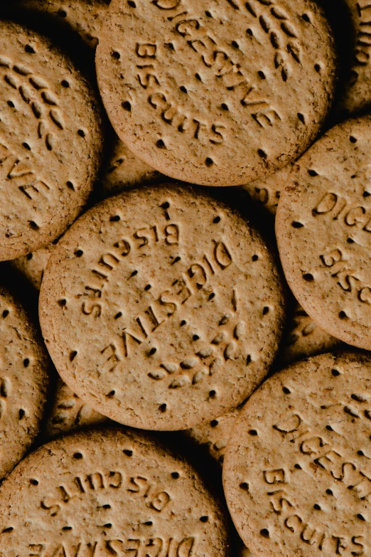 a pile of cookies with writing on them, trending on pexels, excessivism, brown holes, bisley, detailed product shot, dimples