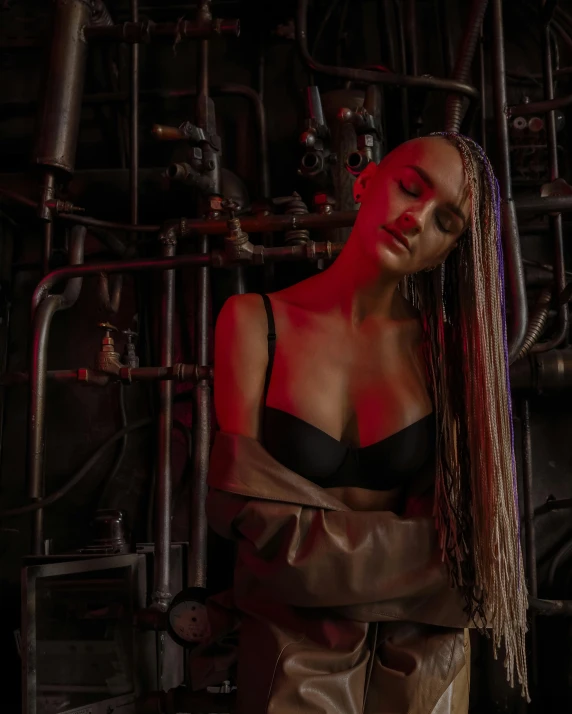 a woman standing in front of a bunch of pipes, an album cover, inspired by Elsa Bleda, pexels contest winner, 8 k sensual lighting, woman in a dark factory, slightly tanned, non binary model