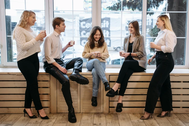 a group of women sitting on top of a window sill, trending on pexels, aussie baristas, avatar image, sitting in a waiting room, professional image