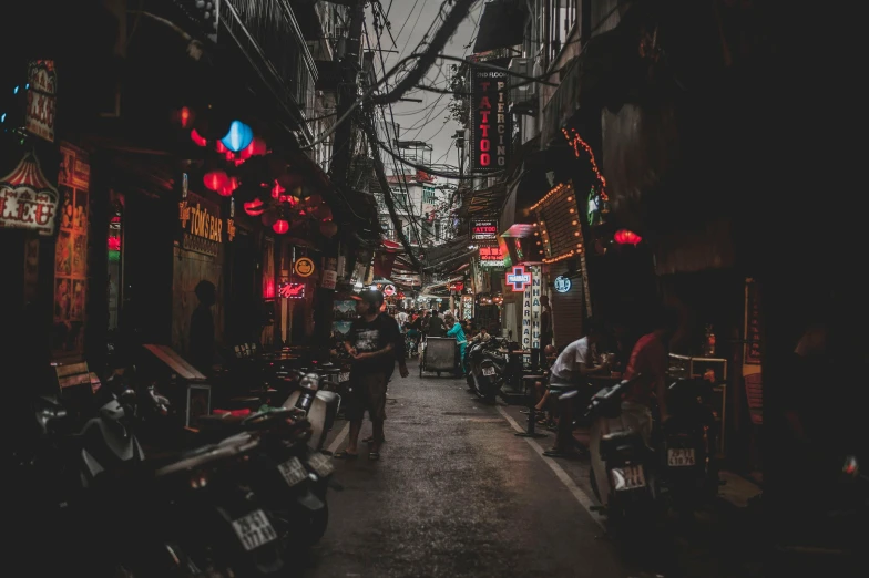a street filled with lots of scooters and motorcycles, a photo, pexels contest winner, graffiti, gloom and lights, old asian village, red neon lights inside it, gif