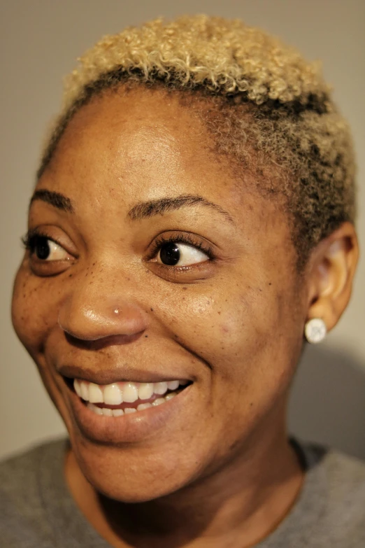 a close up of a person with a cell phone, portrait of ororo munroe, wrinkles and muscles, headshot photograph, smiling playfully