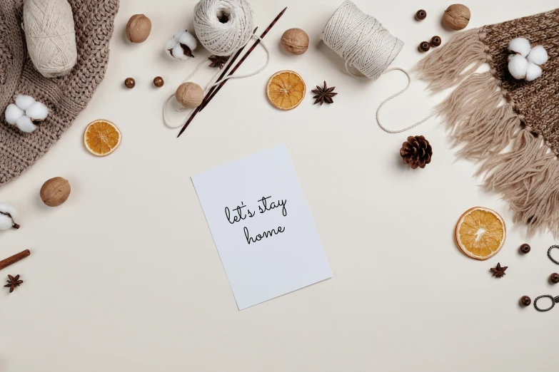 a piece of paper sitting on top of a table, by Julia Pishtar, pexels contest winner, style lettering, cozy home background, card template, let's play