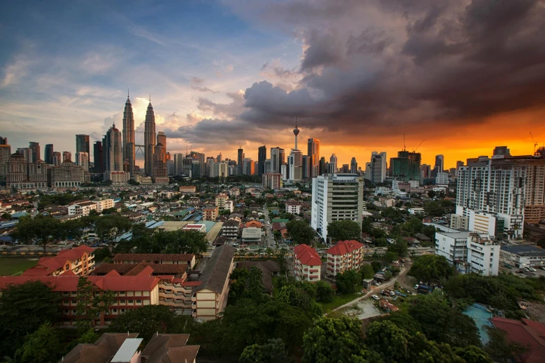 an aerial view of a city at sunset, by Basuki Abdullah, pexels contest winner, hurufiyya, square, malaysian, skyline showing, subtitles