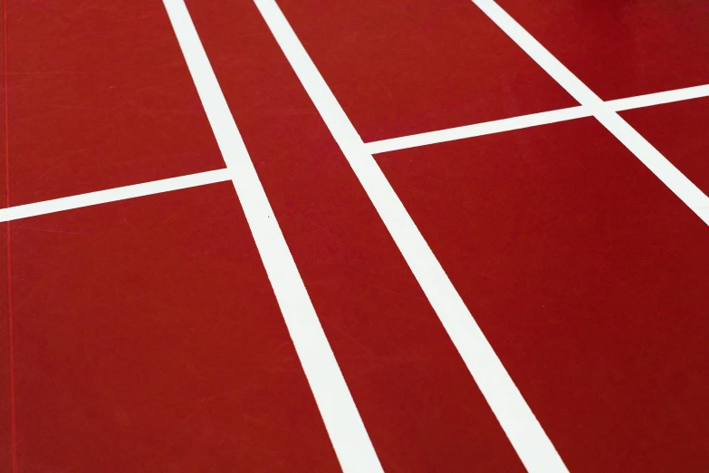 a man standing on top of a tennis court holding a racquet, an album cover, by Paul Bird, unsplash, red and white marble panels, race track background, detailed no. 1 0 downing street, maroon red