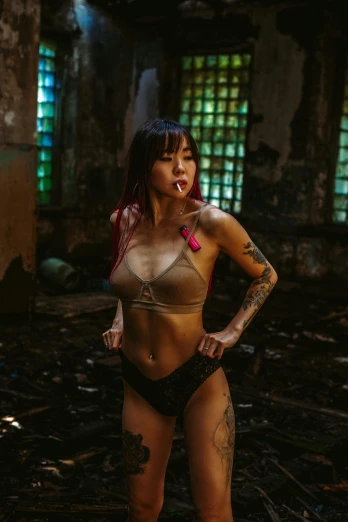 a woman in a bikini posing for a picture, a tattoo, inspired by Elsa Bleda, pexels contest winner, graffiti, star trek asian woman, in a desolate abandoned house, bra and shorts streetwear, burlesque psychobilly