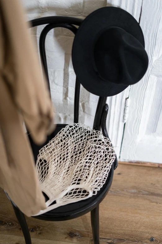 a chair with a hat on top of it, by Nina Hamnett, unsplash, renaissance, fishnet tights, textile, white scarf, 15081959 21121991 01012000 4k