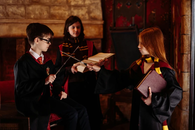 a couple of people that are sitting down, hogwarts gryffindor common room, casting a spell, wearing headmistress uniform, the harry potter trio (harry