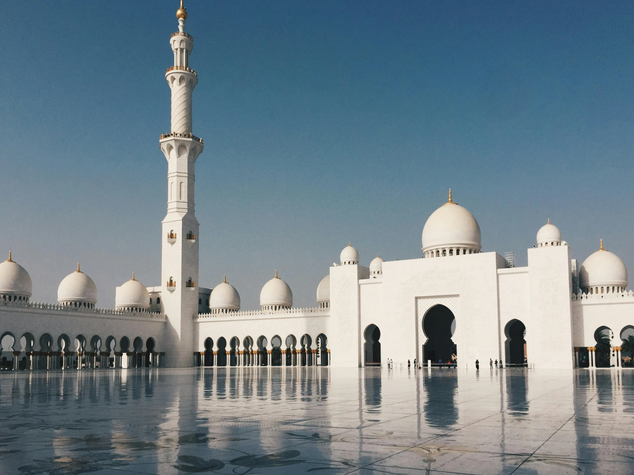 a large white building with a tall tower, pexels contest winner, hurufiyya, arab inspired, foil, 1990s photograph, domes