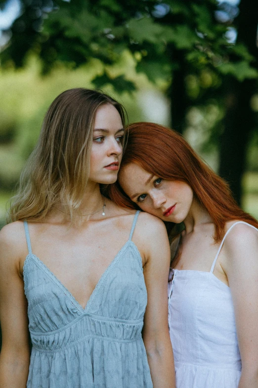 two beautiful young women standing next to each other, inspired by Nan Goldin, trending on pexels, renaissance, sullen old maid ( redhead, summer day, 15081959 21121991 01012000 4k