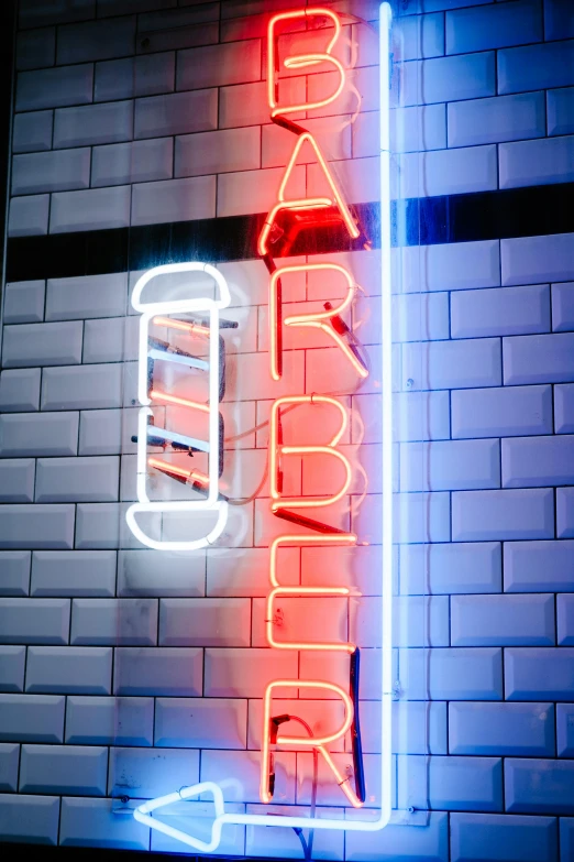 a neon sign in front of a brick wall, inspired by albert aublet, trending on pexels, arabesque, kebab, high angle close up shot, tribarrel, abbeys