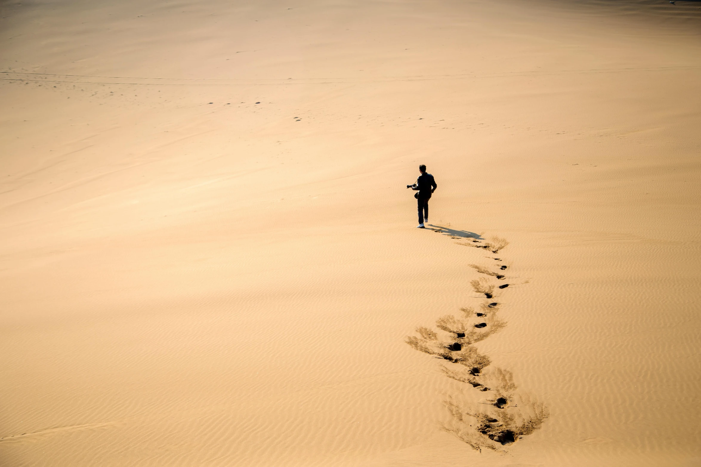 a person that is walking in the sand, by Andries Stock, pexels contest winner, panels, trecking, floating alone, no people 4k