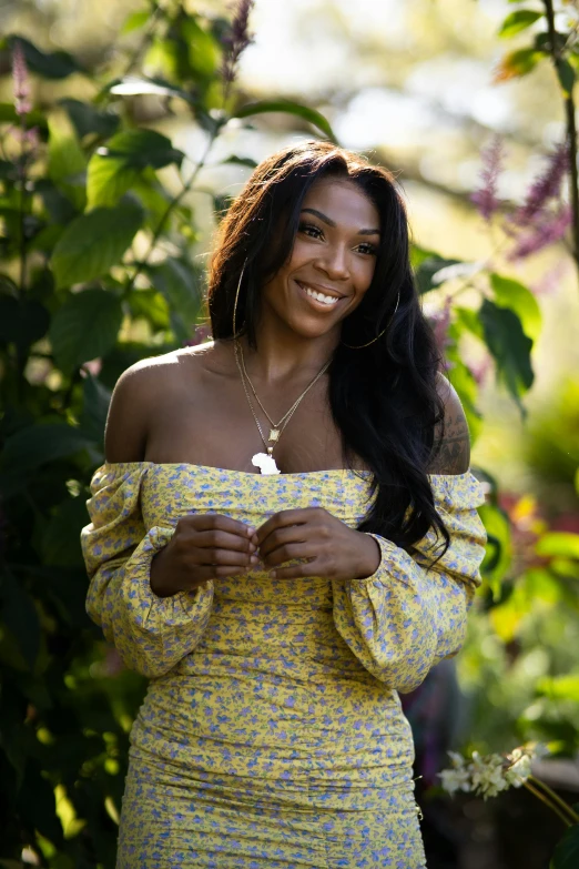 a woman in a yellow dress standing in a garden, serena williams, wearing yellow floral blouse, alexis franklin, full frame image
