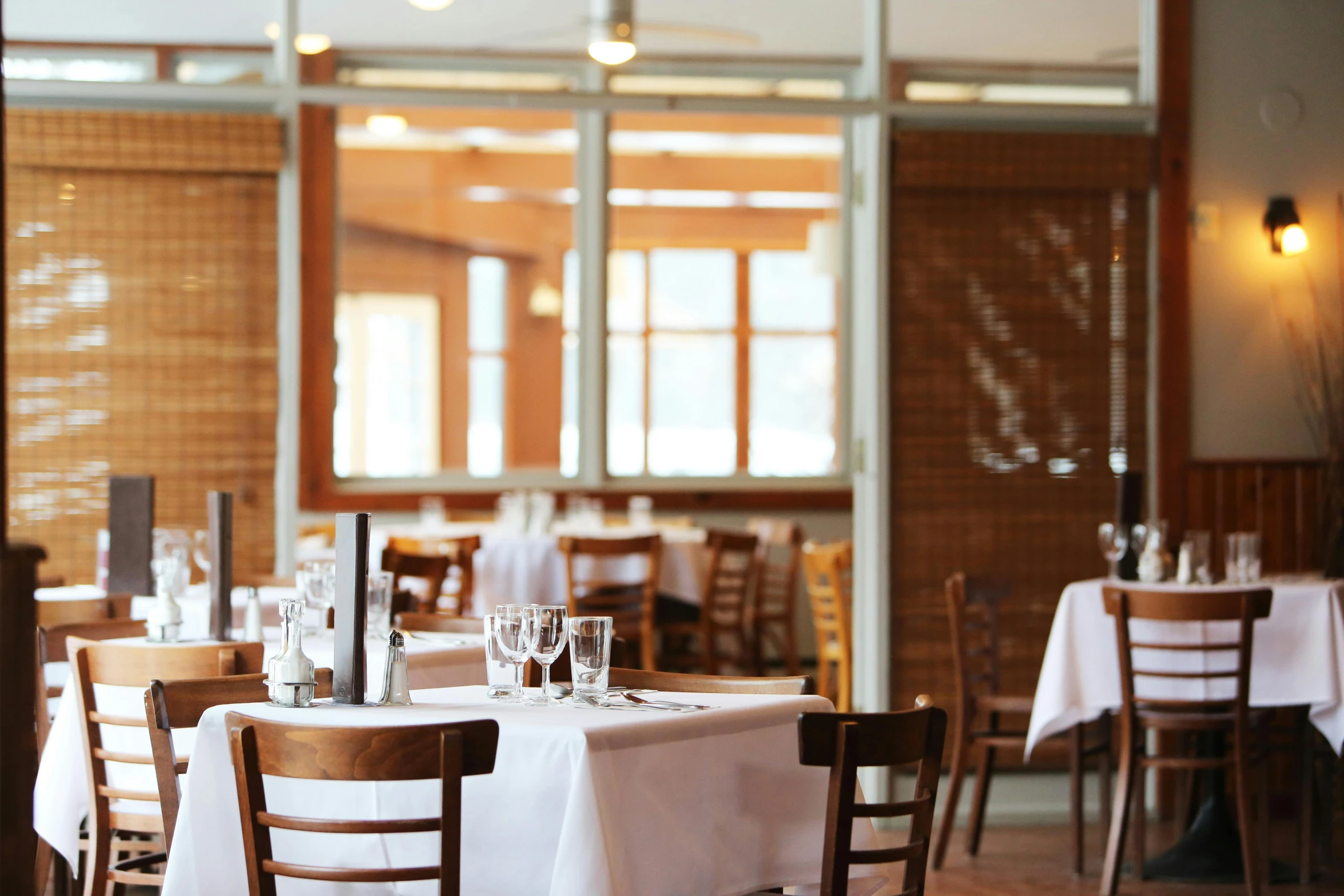 a dining room filled with lots of tables and chairs, a portrait, unsplash, linen, epicurious, brown, hot food