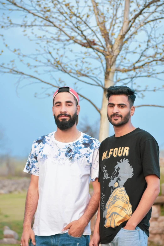 two men standing next to each other in front of a tree, by Manjit Bawa, portrait shot 8 k, 15081959 21121991 01012000 4k, cute boys, transgender